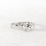 Pear Cut Solitaire with Accents Moissanite Ring - Image 2